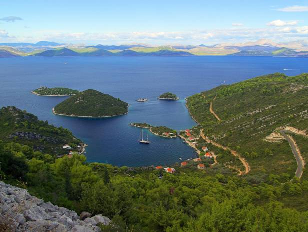 Perfect turquoise water speckled with islands, covered in thick, green foliage