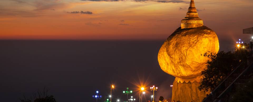 The magnificent boulder resting on the edge of a cliff at Mount Kyaiktiyo