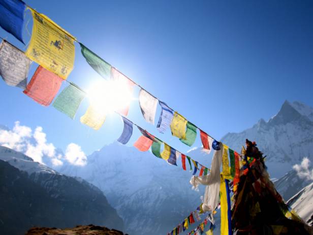 The Tiger Nest temple sitting precariously on the side of a cliff in Paro