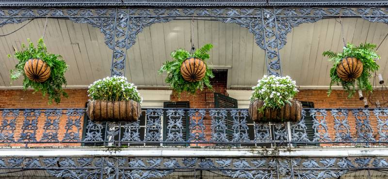 The ornate facade of a typical building in the French Quarter of New Orleans