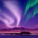 Northern Lights against purple sky - Iceland - On The Go Tours