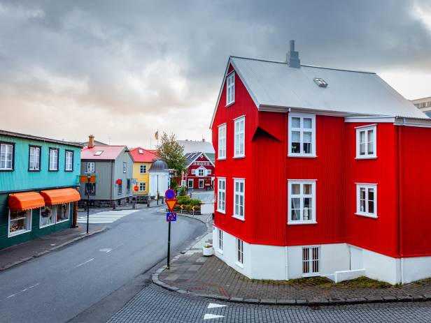 Colourful houses of Reykjavik against a backdrop of snowy mountains