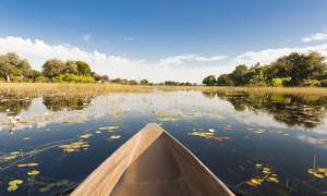 Okavango Delta and dugout canoe - Botswana best time to visit - On The Go Tours