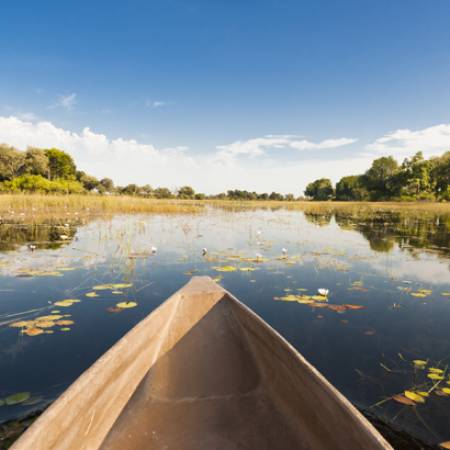 Okavango Delta and dugout canoe - Botswana best time to visit - On The Go Tours