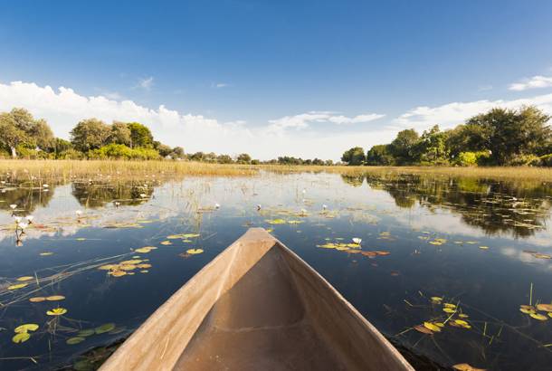 Okavango Delta and dugout canoe - Botswana best time to visit - On The Go Tours