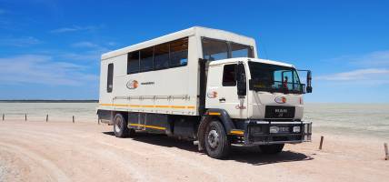 Overland truck at Etosha Pan in Namibia - Africa - On The Go Tours