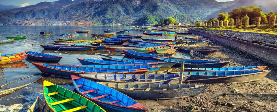 Colourful boats on the edge of the lake in Pokhara