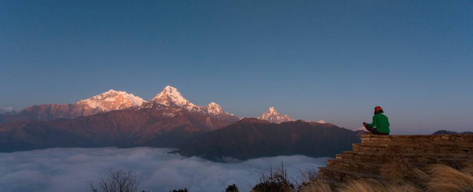 A trekker enjoys the incredible views of Poon Hill in Nepal's Annapurna region