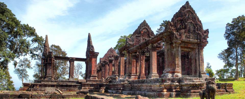 Preah Vihear Temple looking majestic against a blue sky with wispy clouds