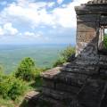 Preah Vihear Temple looking majestic against a blue sky with wispy clouds