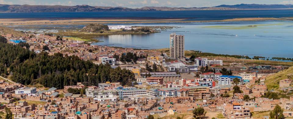 An aerial view of Puno city on the banks of Lake Titicaca in Peru
