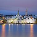 Colourful houses of Reykjavik against a backdrop of snowy mountains