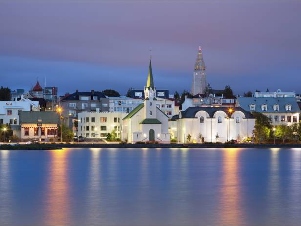 Colourful houses of Reykjavik against a backdrop of snowy mountains