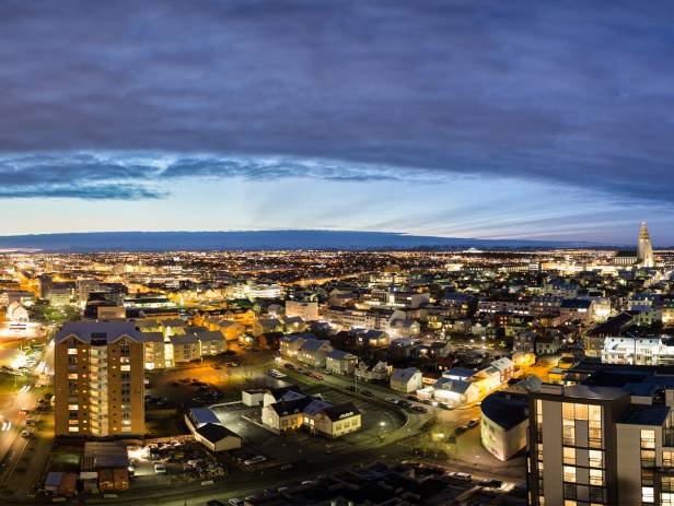 Colourful houses of Reykjavik against a backdrop of snowy mountains