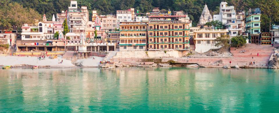 Colourful town of Rishikesh along the edge of the water