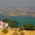 Dazzling blue water of Sea of Galilee running along the edgy of the Jewish Holy City of Tiberias