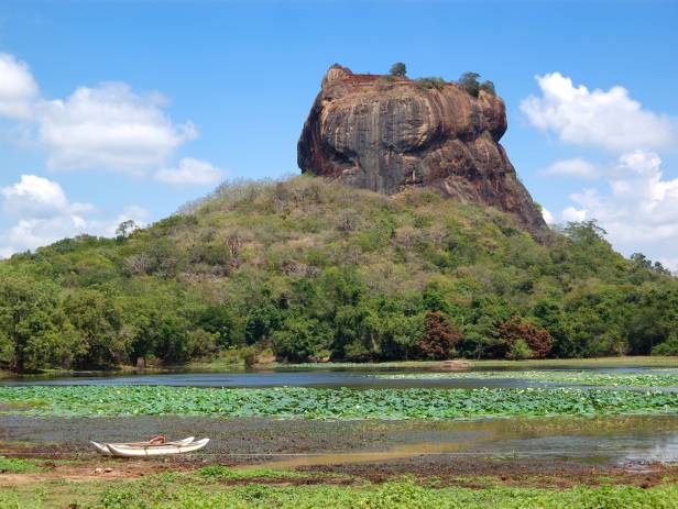 Iconic rock sitting among lush vegetation in Sigiriya