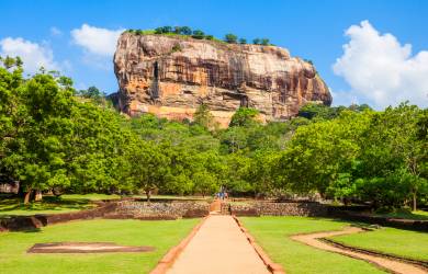 Looking up at the rock fortress of Sigiriya from the water gardens below, Sri Lanka