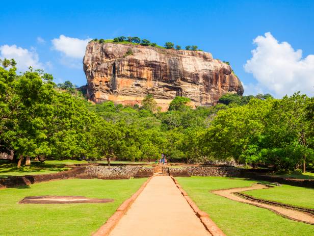 Iconic rock sitting among lush vegetation in Sigiriya