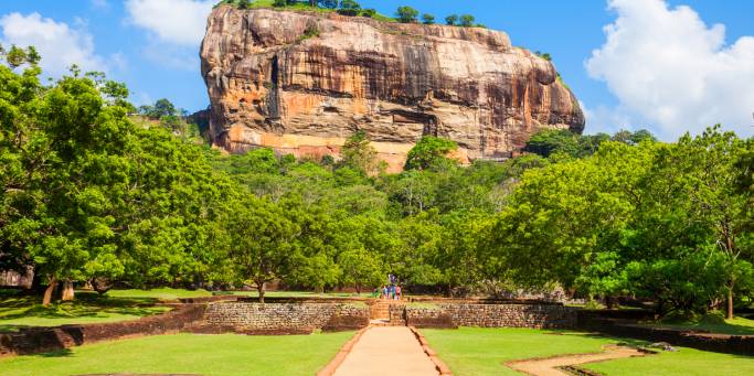 Looking up at the rock fortress of Sigiriya from the water gardens below, Sri Lanka
