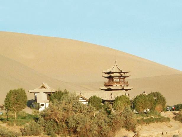 Barren landscape with a flat, red mounatin in the distance