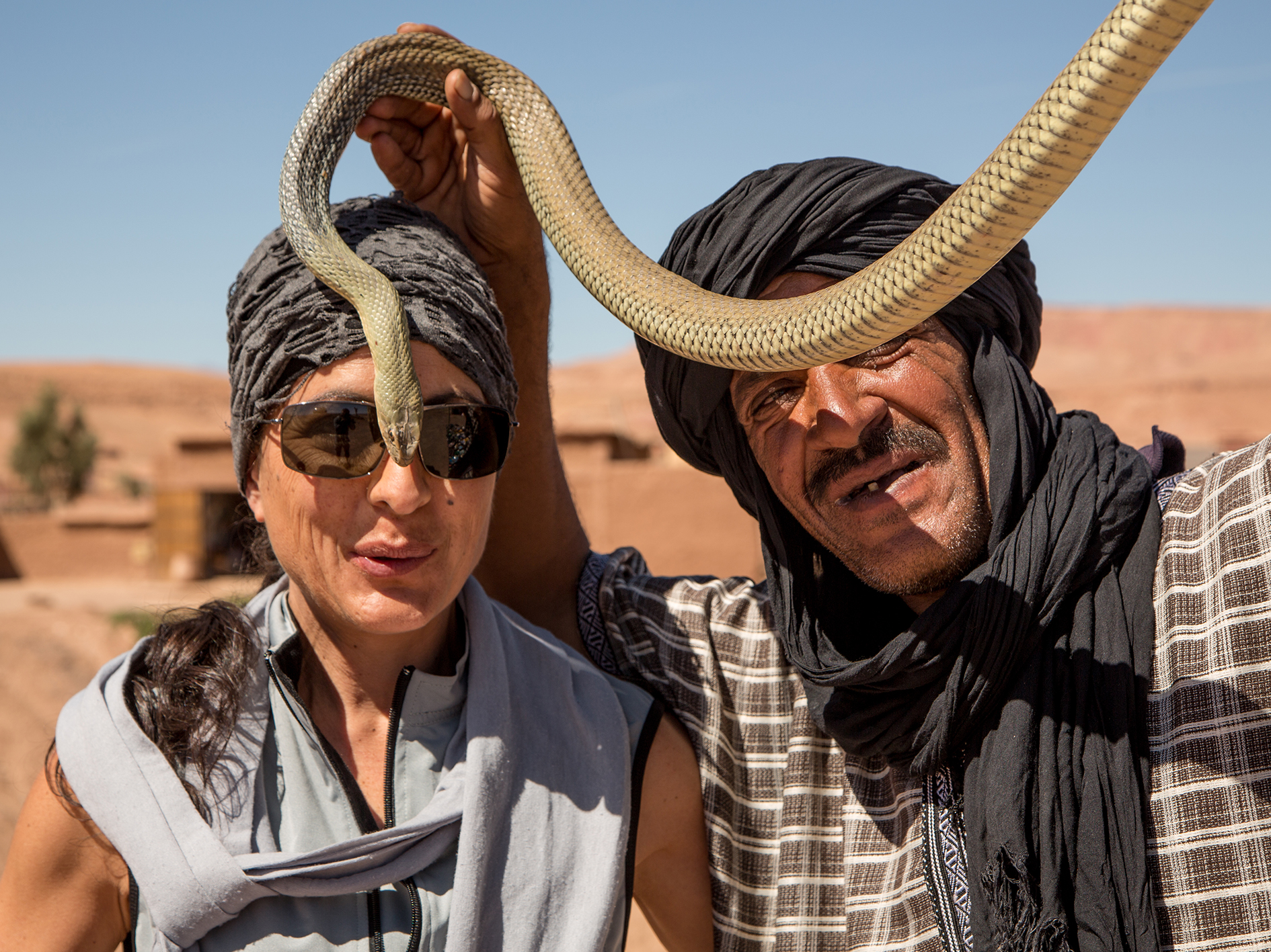A snake charmer and a woman in Morocco