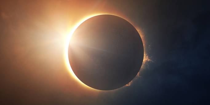 Moon obscuring sun in solar eclipse