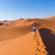 Solo female traveller hiking in the Namibian sand dunes | Namibia