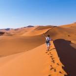 Solo female traveller hiking in the Namibian sand dunes | Namibia
