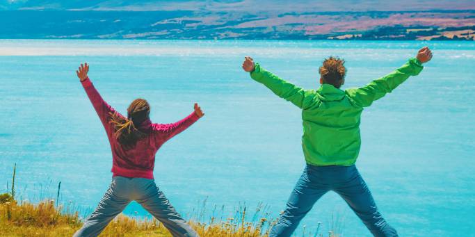 Couple overlooking a lake near Mt Cook | New Zealand