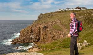 Southern England & Stonehenge main - hiker at lands end