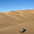 Orange sand dunes stretching into the distance at Sesriem