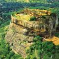 Iconic rock sitting among lush vegetation in Sigiriya