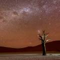 Orange sand dunes and rocky mountains at Namib Naukluft National Park