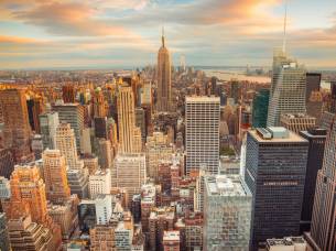 Sunset aerial view of New York City looking over midtown Manhattan towards downtown