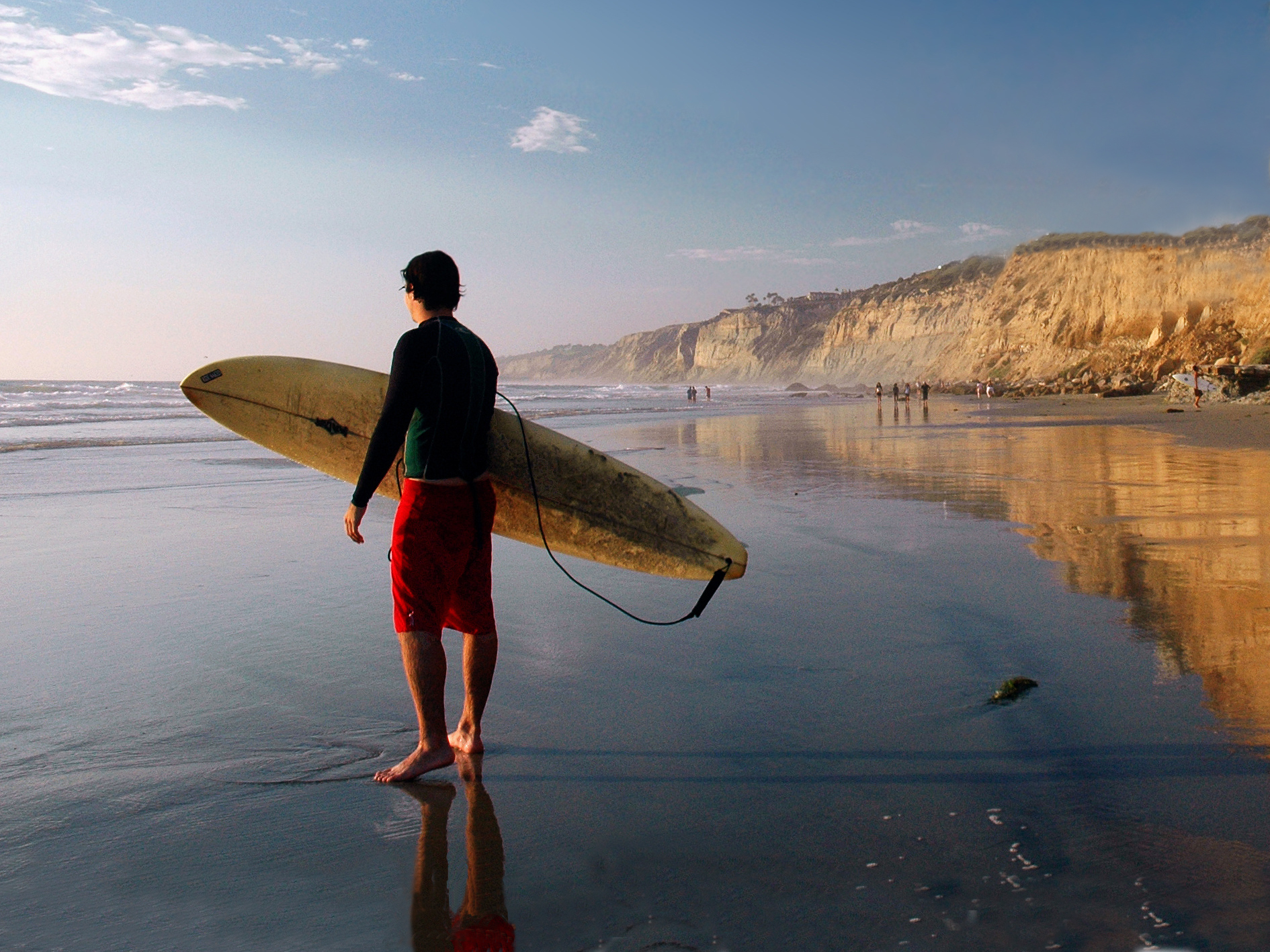 Surfer looking out at the sea