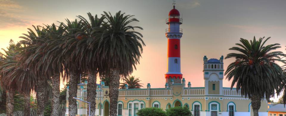 Colonial building and palm trees at dusk in Swakopmund