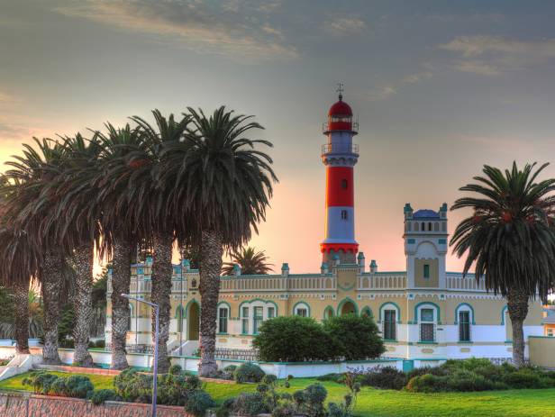 Colonial building and palm trees at dusk in Swakopmund