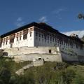 The Tiger Nest temple sitting precariously on the side of a cliff in Paro