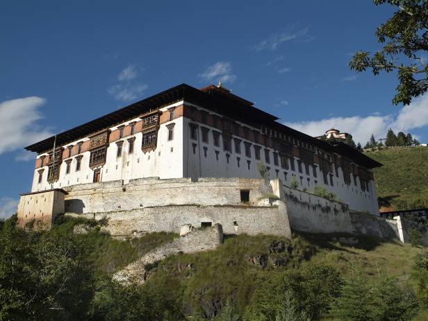 The Tiger Nest temple sitting precariously on the side of a cliff in Paro