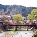 Beautiful, turquoise water surrounded by lush forest in Takayama