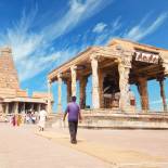 Brahadishwara Temple in Tanjore against a dazzling blue sky with wisps of cloud