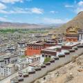 Palace sitting on top of a hill, looking over the Tibetan town of Shigatse