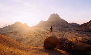 The Big Overlander Northbound main image - lady at Spitzkoppe sunrise