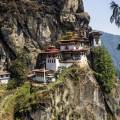 The Tiger Nest temple sitting precariously on the side of a cliff in Paro