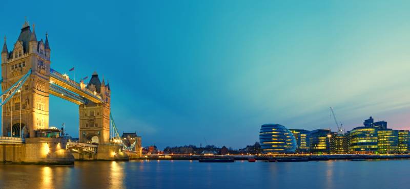 Panoramic view of Tower Bridge on the River Thames in London as dusk settles on the city