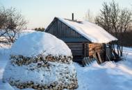 A traditional Russian banya covered in snow