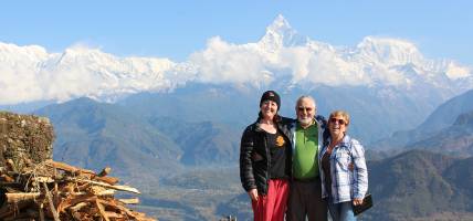 Travellers in Pokhara with Machhapuchhre Peak behind