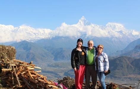 Travellers in Pokhara with Machhapuchhre Peak behind