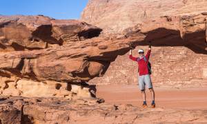 Trek Jordan main image - solo traveller on rocks - Jordan